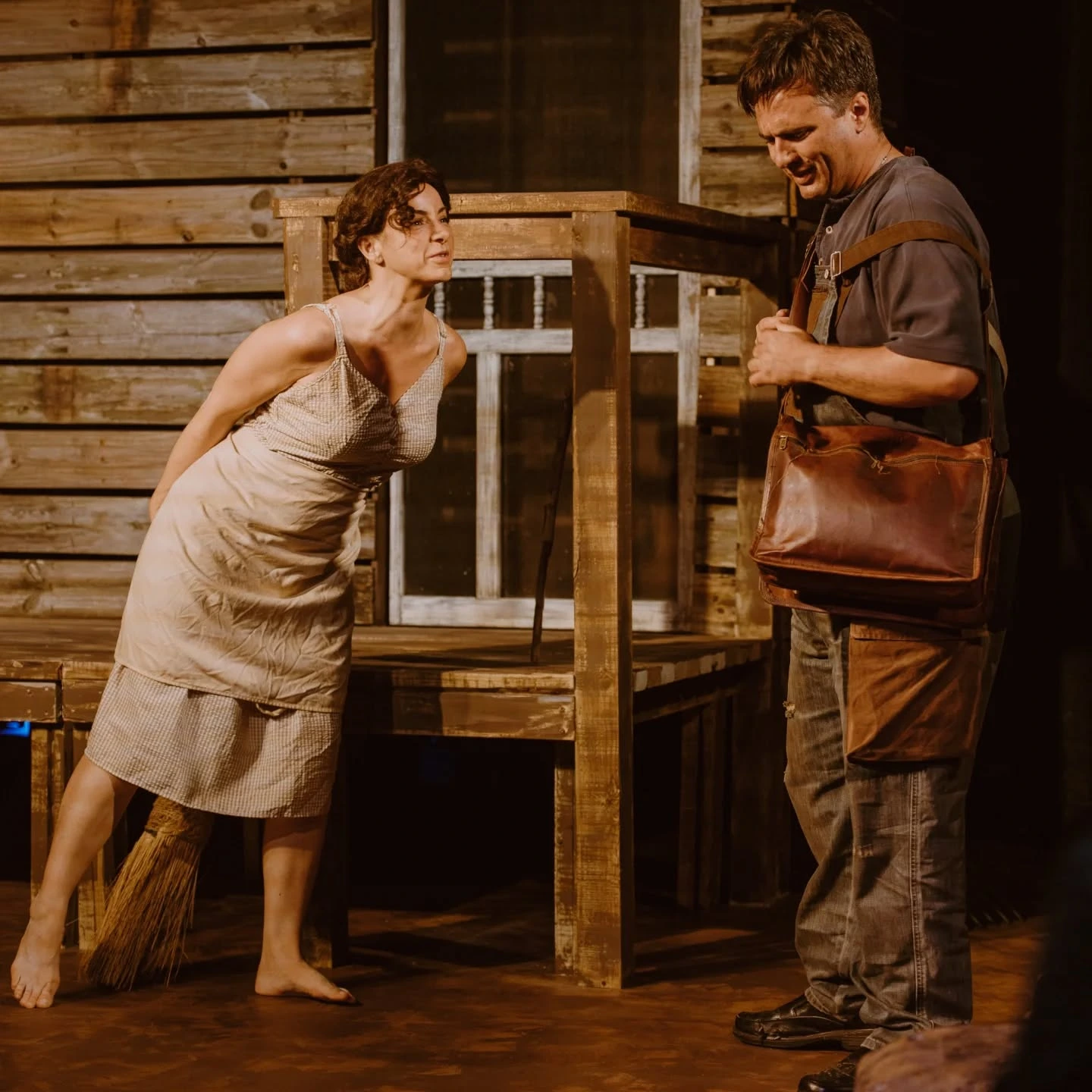 Josie leans playfully toward Mike outside the farmhouse in 'A Moon for the Misbegotten' at ABET.