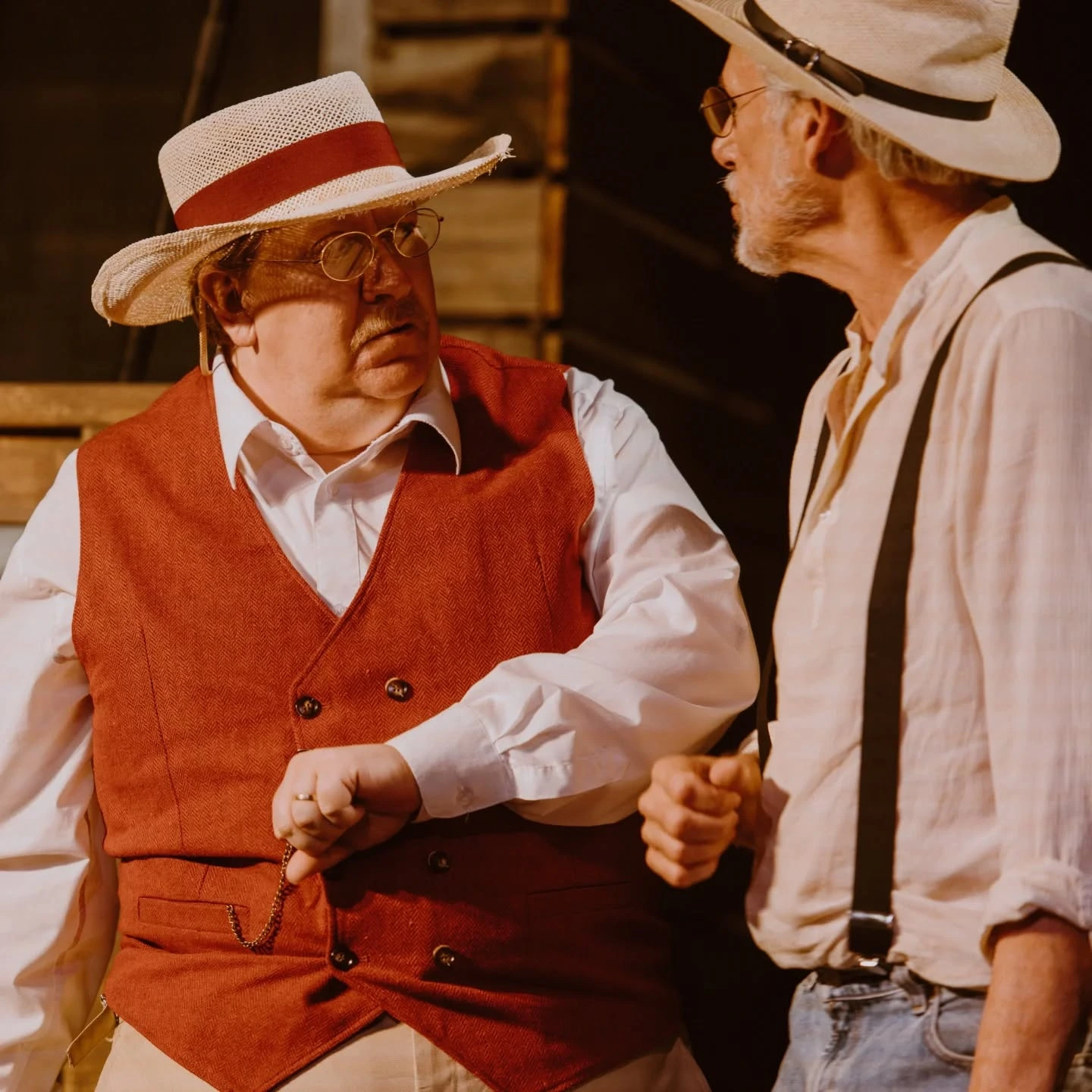 Harder, dressed in a red vest and straw hat, speaks with Phil outside the Hogan farmhouse in 'A Moon for the Misbegotten' at ABET.